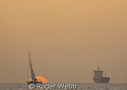 Bequia at sundown... by Roger Webb 